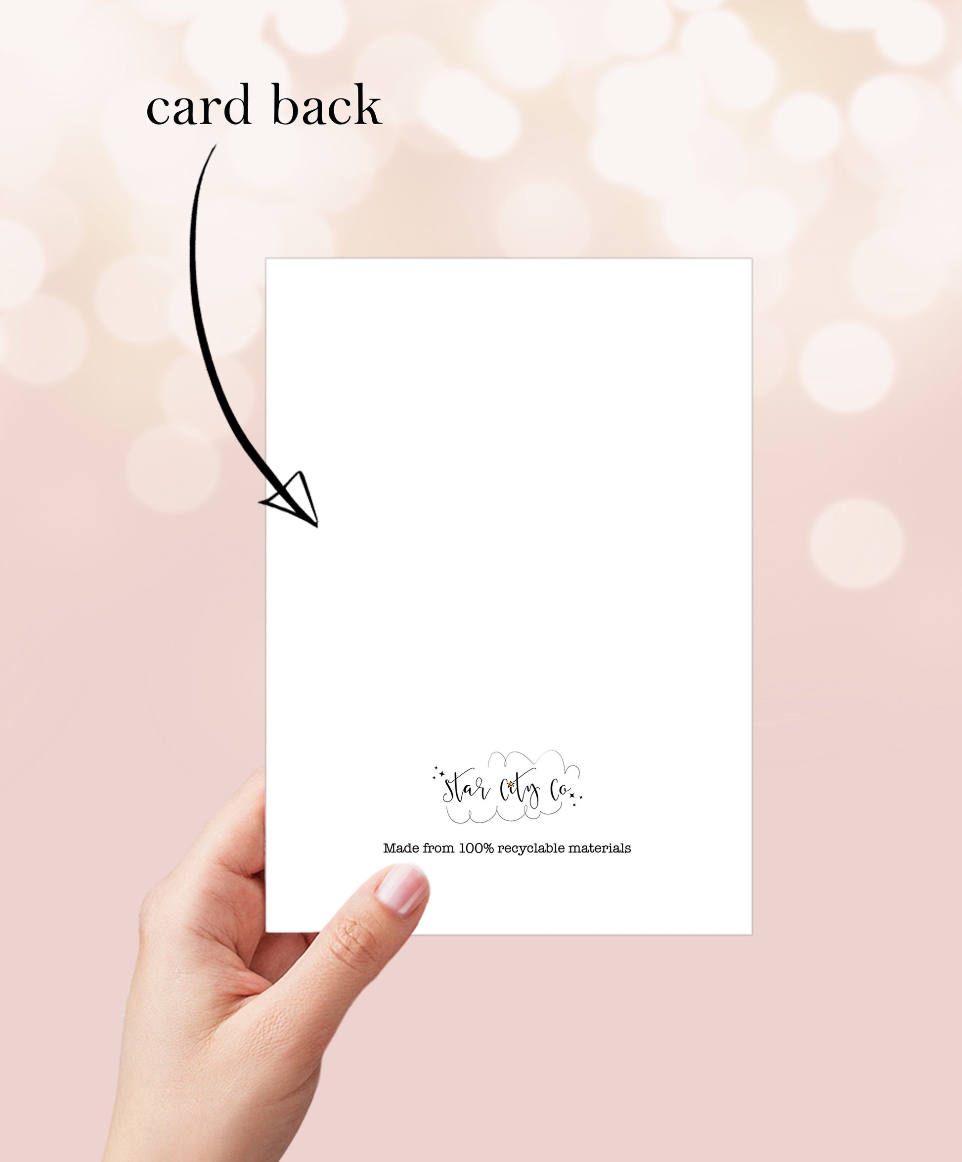 Hand holding blank greeting card with "card back" text and recycling information.
